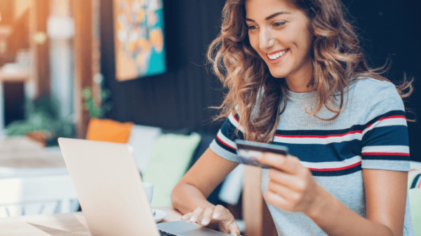 Girl with laptop and card