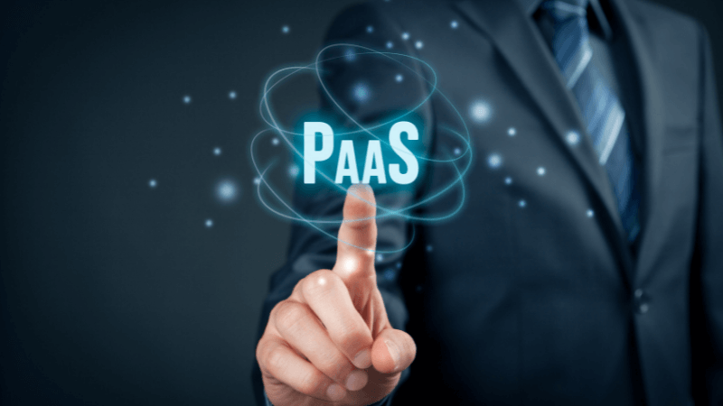 Man in suit pointing finger at the word PaaS