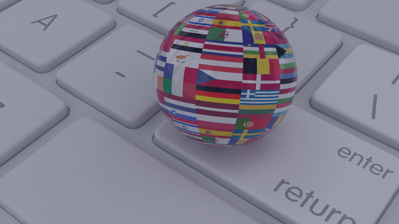Globe made out of multiple flags sitting on keyboard